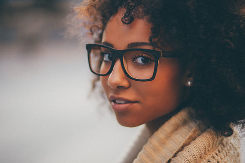 black-girl-closeup-wooden-sunglasses-curly-hair-look-back.jpg