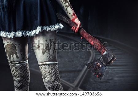 stock-photo-horror-dirty-woman-s-hand-holding-a-bloody-axe-outdoor-in-night-forest-149703656.jpg