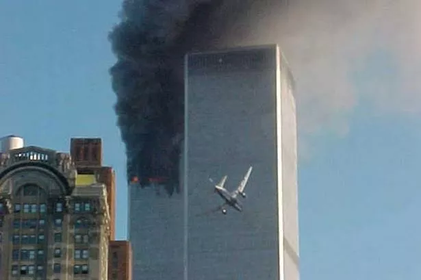 aircraft-flies-into-the-second-world-trade-centre-tower-979020675.jpg