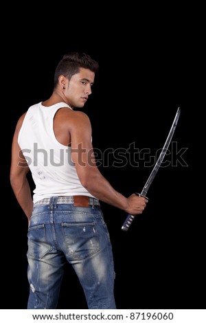 stock-photo-young-warrior-holding-a-ninja-sword-isolated-on-black-87196060.jpg
