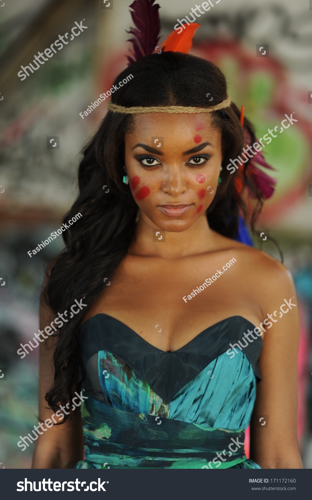 stock-photo-portrait-of-young-beautiful-indian-cherokee-woman-with-feathers-in-her-hair-and-traditional-makeup-171172160.jpg