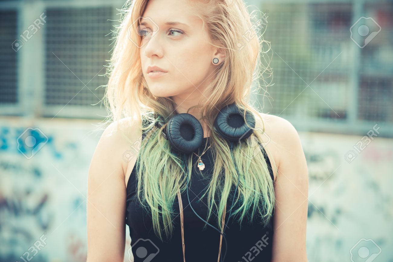 36065525-beautiful-young-blonde-hair-woman-hipster-listening-music-in-the-city-Stock-Photo.jpg