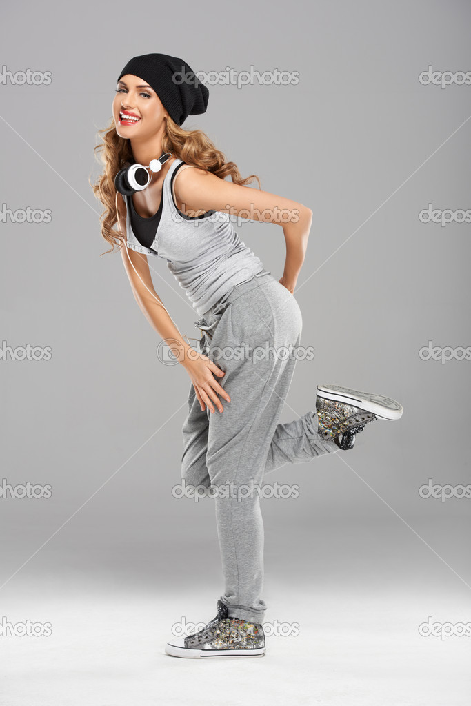 depositphotos_13863836-Female-modern-dancer-posing-on-grey.jpg