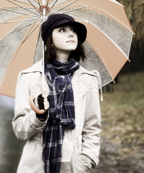 878097_stock-photo-girl-with-umbrella-at-park-in-rainy-day-photo-in-vintage-style.jpg