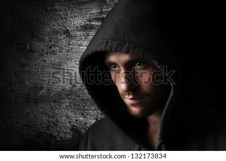 stock-photo-portrait-of-a-young-angry-man-in-the-hood-132173834.jpg