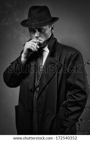 stock-photo-film-noir-retro-styled-fashion-portrait-of-a-detective-172540352.jpg