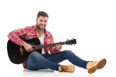 male-guitarist-acoustic-guitar-red-lumberjack-shirt-sitting-floor-play-black-full-length-studio-shot-isolated-49576394.jpg