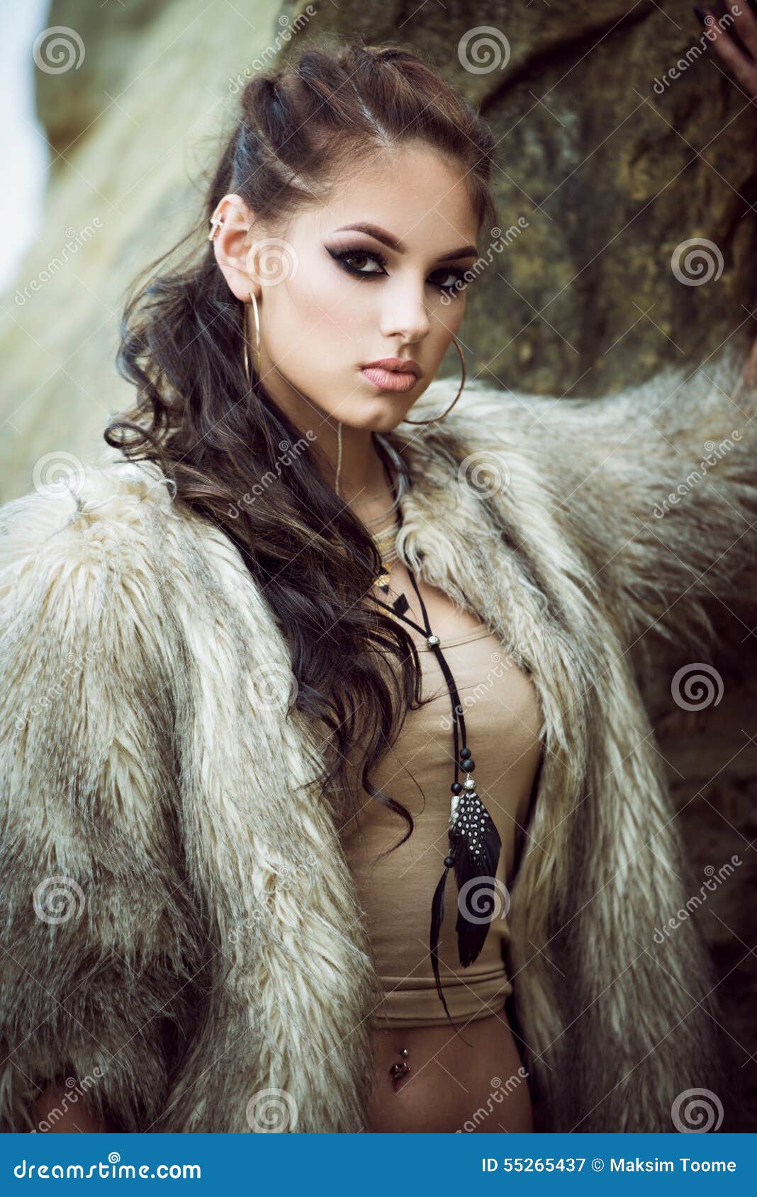 fur-coat-flash-tattoos-portrait-beautiful-lady-tottoos-posing-outdoors-near-sea-55265437.jpg