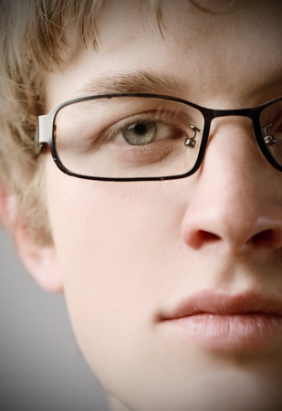 11571385-closeup-of-a-young-man-wearing-eyeglasses.jpg