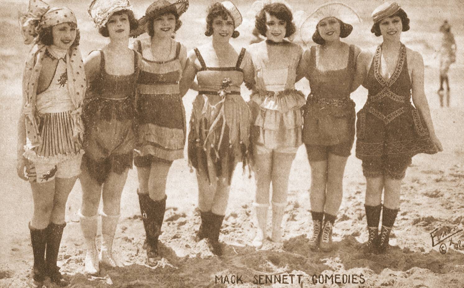 arcade-card-mack-sennett-comedies-7-women-in-bathing-suits-on-beach.jpg