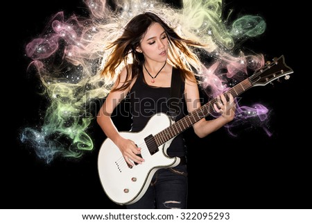 stock-photo-young-and-beautiful-rock-girl-playing-the-electric-guitar-with-fantasy-smoke-and-glitter-star-322095293.jpg